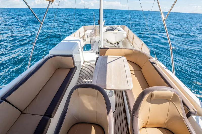 Wanderer Yacht Photos Pics 2016 Beneteau Swift Trawler 44, spacious deck with seating, cruising on open sea.