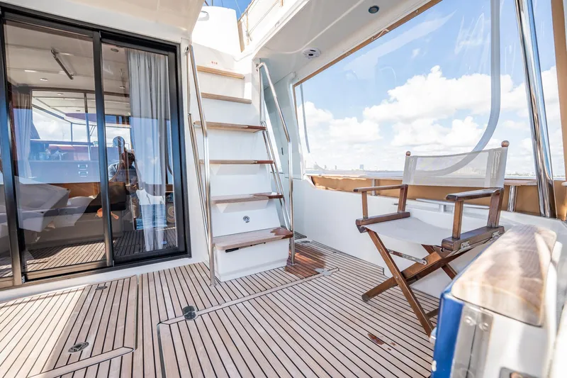 Wanderer Yacht Photos Pics 2016 Beneteau Swift Trawler 44 deck with wooden flooring and seating.