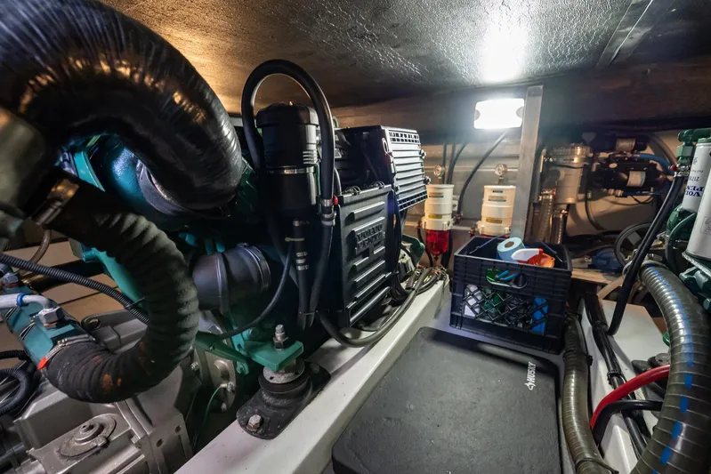 Wanderer Yacht Photos Pics Engine room of 2016 Beneteau Swift Trawler 44, showcasing mechanical components and storage.