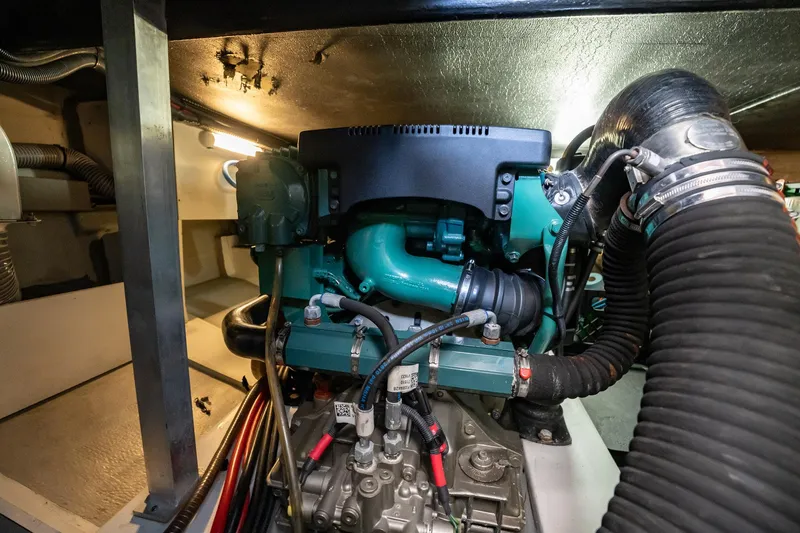 Wanderer Yacht Photos Pics Engine room of 2016 Beneteau Swift Trawler 44, showcasing mechanical components and hoses.
