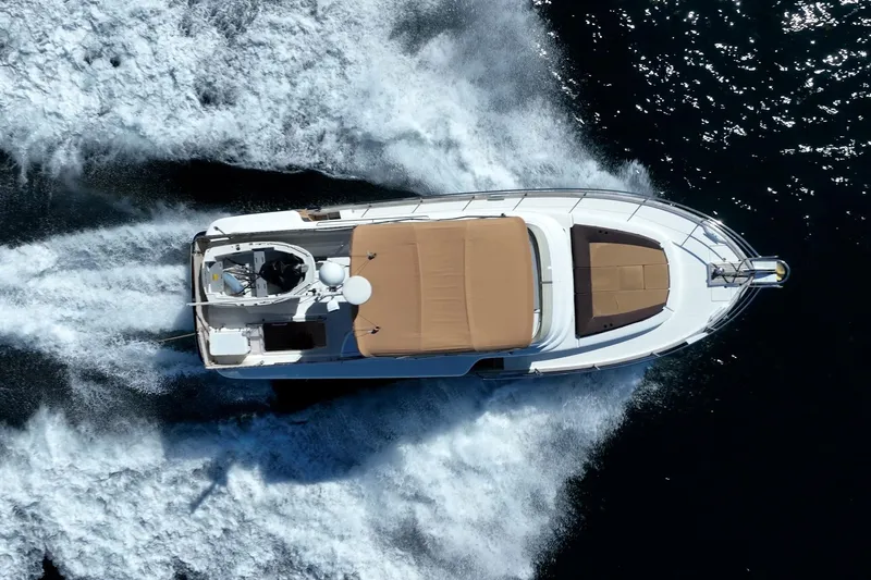 Wanderer Yacht Photos Pics Aerial view of 2016 Beneteau Swift Trawler 44 cruising on open water.