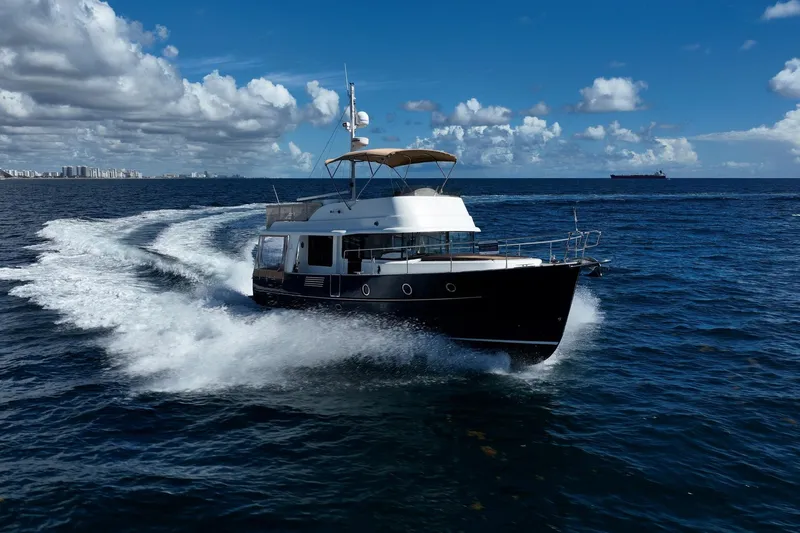 Wanderer Yacht Photos Pics 2016 Beneteau Swift Trawler 44 cruising on open ocean under blue sky.