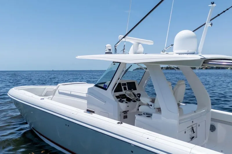  Yacht Photos Pics 2021 Intrepid 407 Panacea boat on calm blue water, showcasing sleek design and modern features.