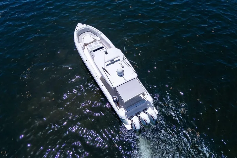  Yacht Photos Pics Aerial view of 2021 Intrepid 407 Panacea boat cruising on open water.