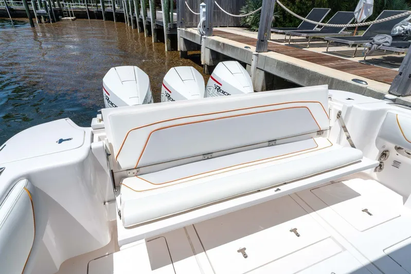  Yacht Photos Pics 2021 Intrepid 407 Panacea boat with white seating and powerful outboard engines.