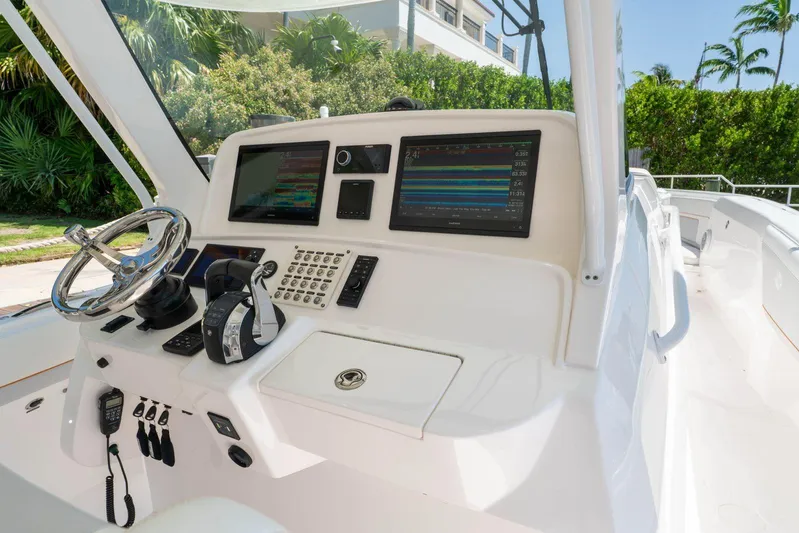  Yacht Photos Pics 2021 Intrepid 407 Panacea helm with advanced navigation displays and controls.