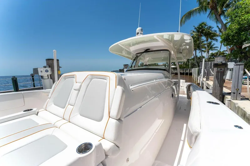  Yacht Photos Pics 2021 Intrepid 407 Panacea boat docked, featuring sleek white design and luxurious seating.