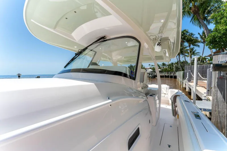  Yacht Photos Pics 2021 Intrepid 407 Panacea boat docked, showcasing sleek design and modern features.