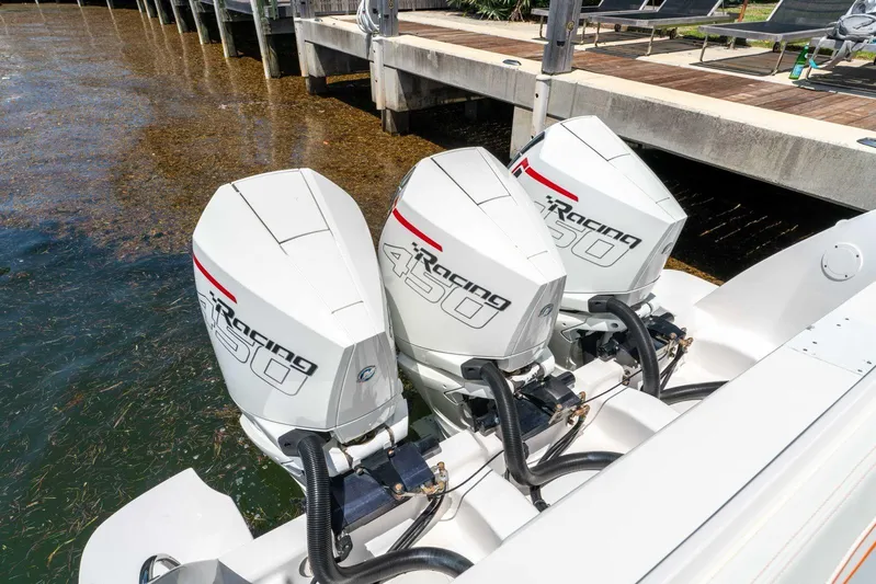  Yacht Photos Pics Triple Mercury Racing 450 engines on a 2021 Intrepid 407 Panacea boat docked by the water.