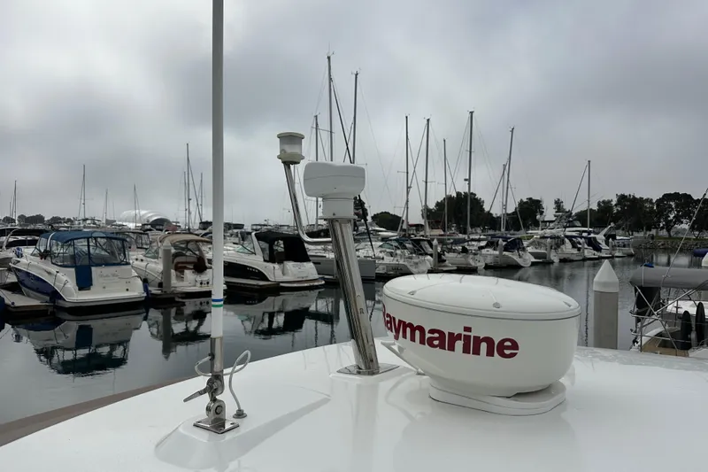  Yacht Photos Pics Jeanneau NC11 2015 yacht with Raymarine equipment docked in a marina.