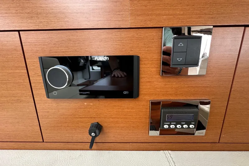  Yacht Photos Pics Control panel on 2015 Jeanneau NC11 boat with audio and climate controls.