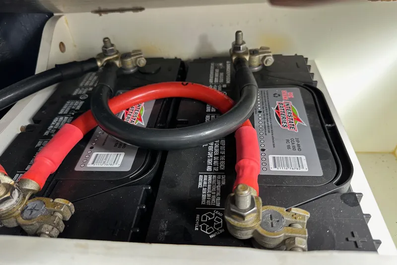  Yacht Photos Pics Battery compartment of a 2015 Jeanneau NC11 with Interstate batteries and red cables.
