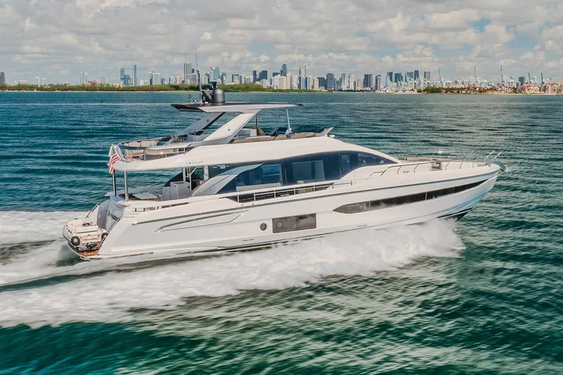 Transcendence Yacht Photos Pics Azimut 78 Flybridge 2020 yacht cruising near city skyline on a sunny day.