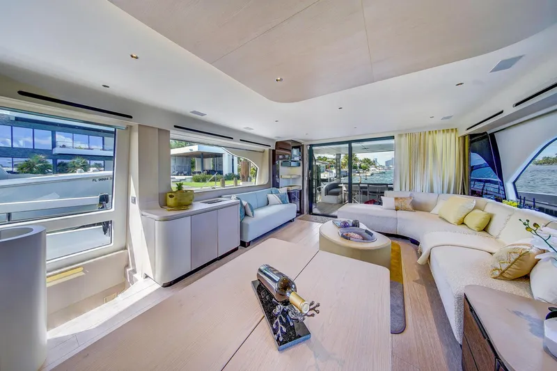 Transcendence Yacht Photos Pics Luxurious interior of 2020 Azimut 78 Flybridge yacht with elegant seating and panoramic windows.