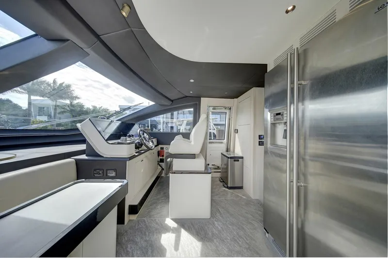 Transcendence Yacht Photos Pics Luxurious interior of 2020 Azimut 78 Flybridge yacht with modern helm and sleek design.