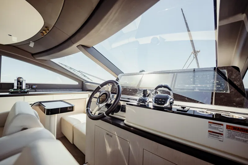 Transcendence Yacht Photos Pics Luxurious interior of 2020 Azimut 78 Flybridge yacht with modern helm and panoramic windows.