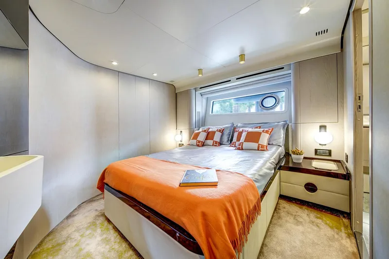 Transcendence Yacht Photos Pics Luxurious bedroom interior on 2020 Azimut 78 Flybridge yacht, featuring modern design and cozy decor.