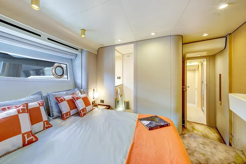 Transcendence Yacht Photos Pics Luxurious bedroom interior of 2020 Azimut 78 Flybridge yacht with elegant decor and modern amenities.