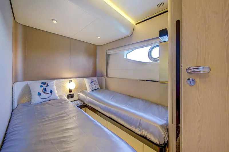 Transcendence Yacht Photos Pics Luxurious cabin interior of 2020 Azimut 78 Flybridge yacht with twin beds.