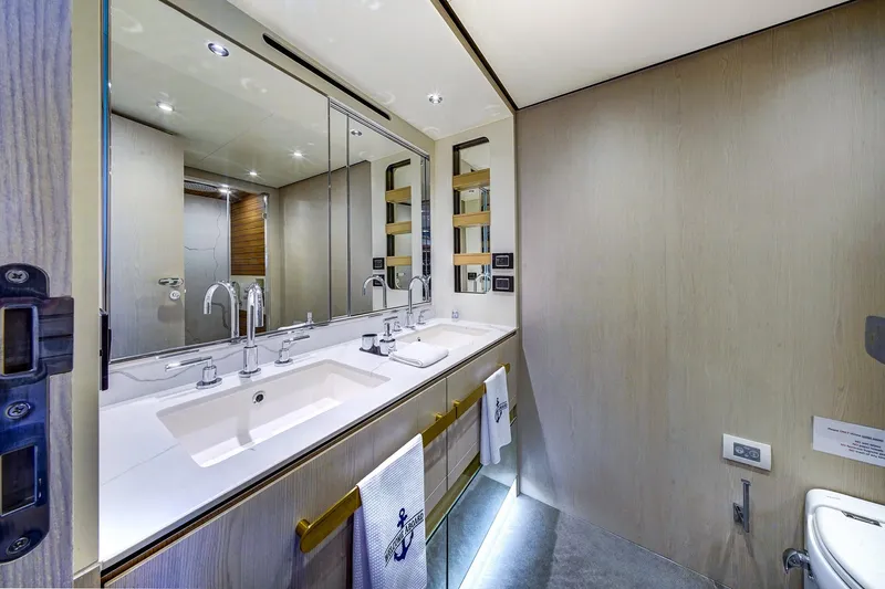 Transcendence Yacht Photos Pics Luxurious bathroom in 2020 Azimut 78 Flybridge yacht with dual sinks and modern fixtures.