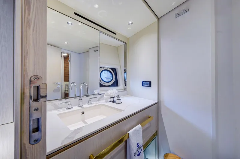 Transcendence Yacht Photos Pics Luxurious bathroom on 2020 Azimut 78 Flybridge yacht with modern fixtures and elegant design.