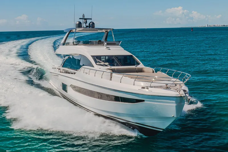 Transcendence Yacht Photos Pics Azimut 78 Flybridge 2020 yacht cruising on open sea, creating a dynamic water trail.