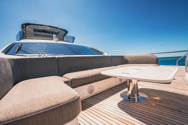 Transcendence Yacht Photos Pics Luxurious 2020 Azimut 78 Flybridge yacht with elegant outdoor seating and table.