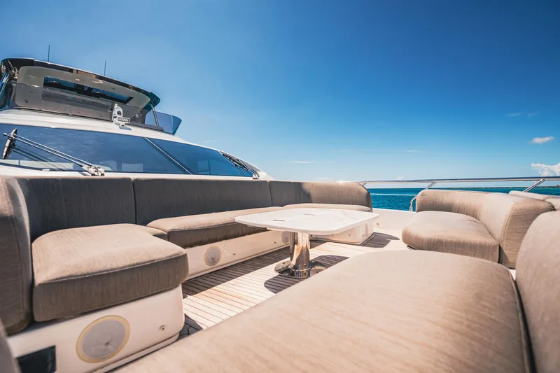 Transcendence Yacht Photos Pics Luxurious 2020 Azimut 78 Flybridge yacht with spacious outdoor seating under clear blue skies.