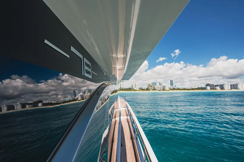 Transcendence Yacht Photos Pics Azimut 78 Flybridge yacht cruising near city skyline, 2020 model.