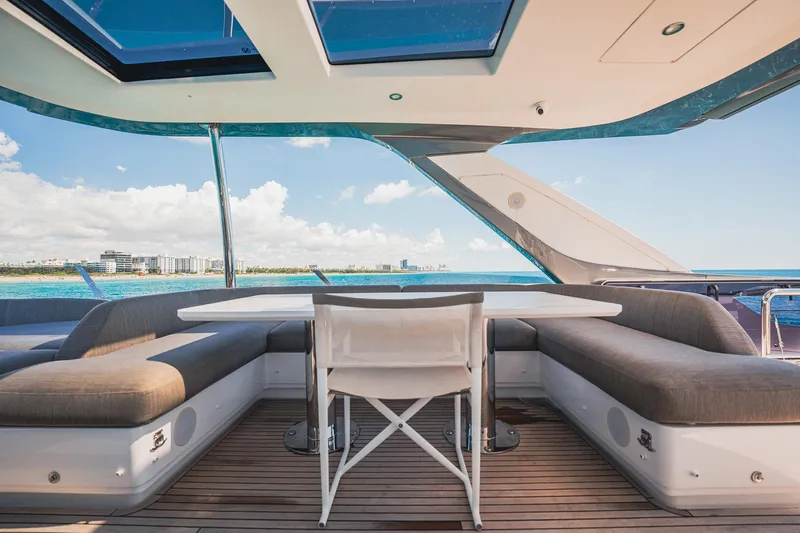 Transcendence Yacht Photos Pics Luxurious Azimut 78 Flybridge yacht deck with seating, ocean view, and modern design, 2020 model.