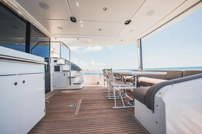 Transcendence Yacht Photos Pics Luxurious Azimut 78 Flybridge yacht deck with seating, ocean view, and modern design, 2020 model.