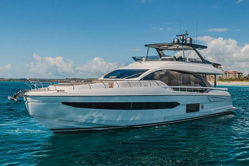 Transcendence Yacht Photos Pics 2020 Azimut 78 Flybridge yacht cruising on clear blue water under a sunny sky.