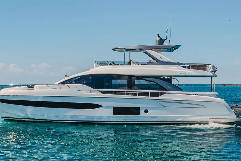 Transcendence Yacht Photos Pics Luxurious 2020 Azimut 78 Flybridge yacht cruising on clear blue waters.