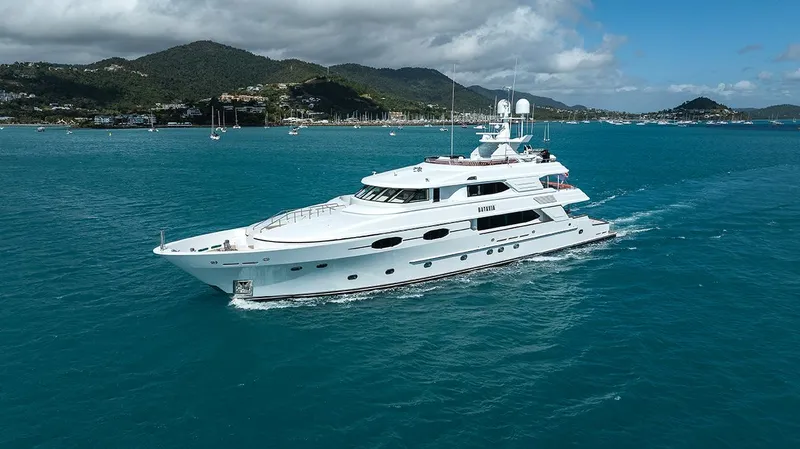  Yacht Photos Pics Luxurious 2003 Sovereign Tri-Deck yacht cruising in turquoise waters under a clear sky.