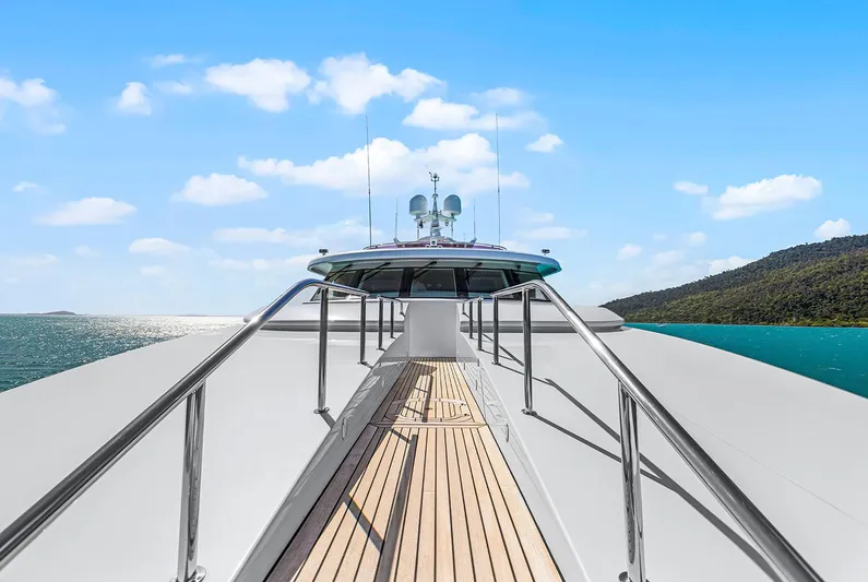  Yacht Photos Pics Luxurious 2003 Sovereign Tri-Deck yacht deck with ocean view and clear blue sky.