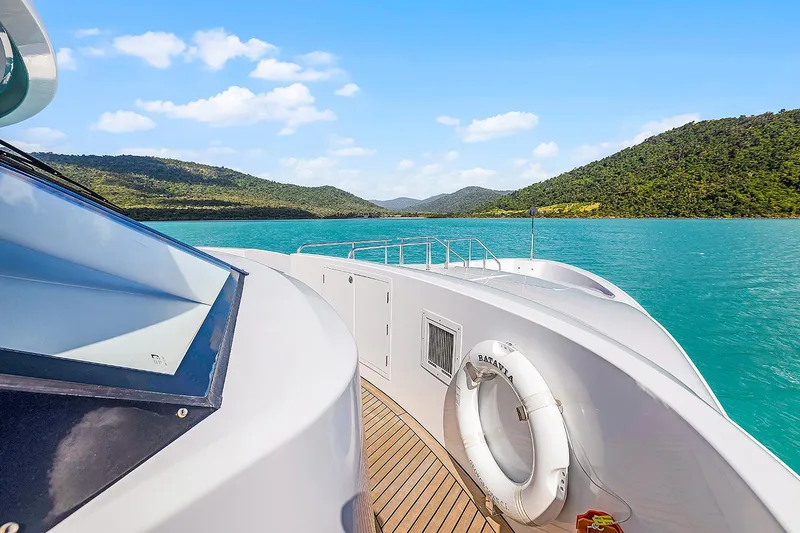  Yacht Photos Pics Luxurious 2003 Sovereign Tri-Deck yacht cruising on turquoise waters with scenic mountain views.