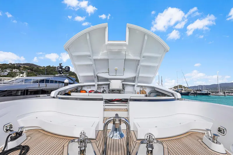  Yacht Photos Pics Luxury Sovereign Tri-Deck yacht, 2003 model, docked with open deck view under blue sky.