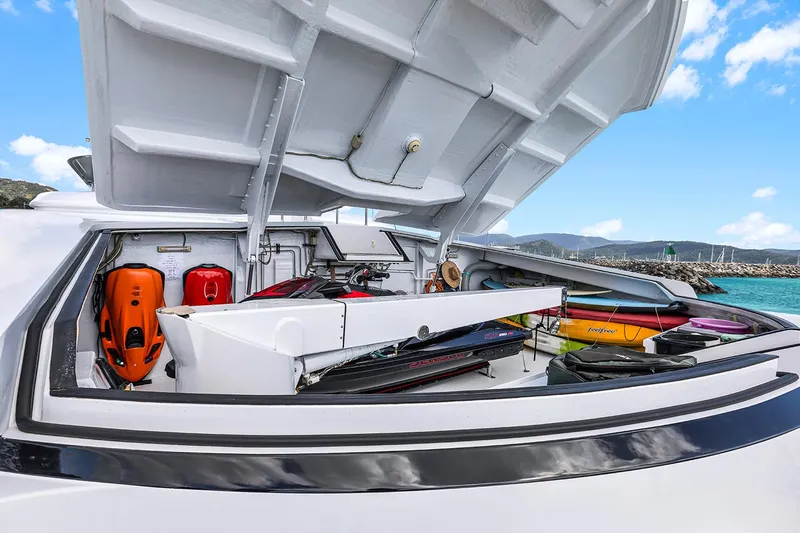  Yacht Photos Pics Open storage compartment on 2003 Sovereign Tri-Deck yacht with water sports equipment.