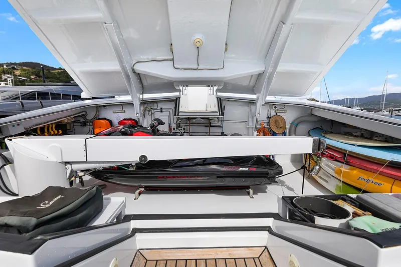  Yacht Photos Pics Luxurious 2003 Sovereign Tri-Deck yacht with open deck storage and water sports equipment.