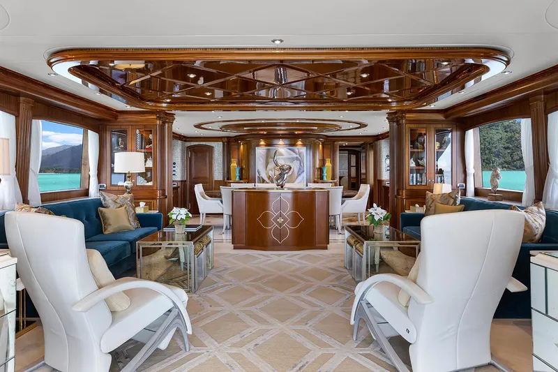  Yacht Photos Pics Luxurious interior of 2003 Sovereign Tri-Deck yacht with elegant furnishings and wood accents.