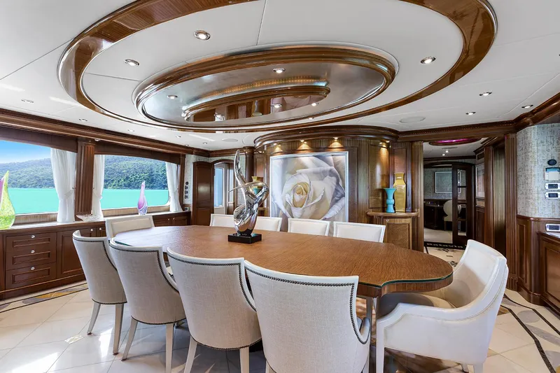  Yacht Photos Pics Luxurious dining area on 2003 Sovereign Tri-Deck yacht with elegant decor and scenic views.