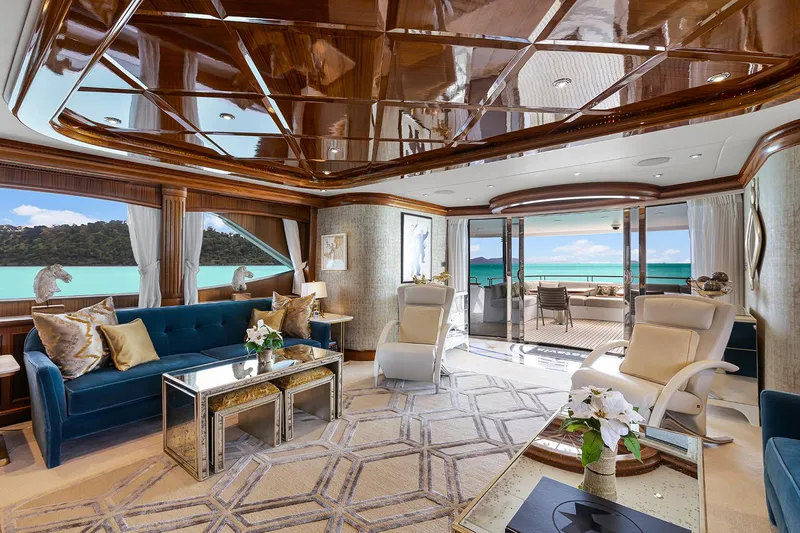  Yacht Photos Pics Luxurious interior of 2003 Sovereign Tri-Deck yacht with elegant furnishings and ocean view.