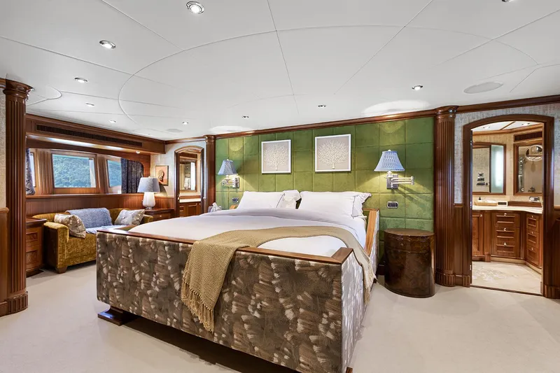  Yacht Photos Pics Luxurious Sovereign Tri-Deck 2003 yacht bedroom with elegant decor and plush furnishings.