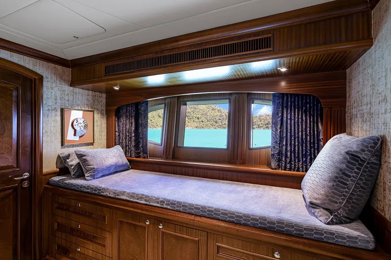  Yacht Photos Pics Luxurious cabin interior of 2003 Sovereign Tri-Deck yacht with scenic window view.