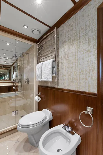  Yacht Photos Pics Luxurious bathroom on 2003 Sovereign Tri-Deck yacht with modern fixtures and elegant design.