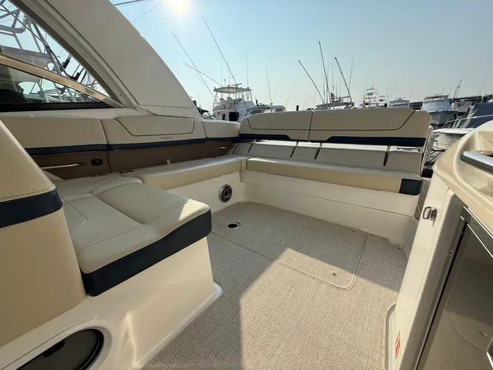  Yacht Photos Pics 2024 Formula 350 Crossover Bowrider interior with beige seating and spacious layout.
