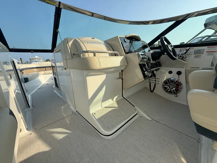  Yacht Photos Pics 2024 Formula 350 Crossover Bowrider interior with helm, seating, and modern controls.