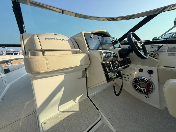  Yacht Photos Pics 2024 Formula 350 Crossover Bowrider helm with modern controls and luxurious seating.