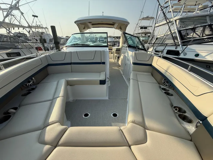  Yacht Photos Pics 2024 Formula 350 Crossover Bowrider with spacious seating and modern design in a marina setting.