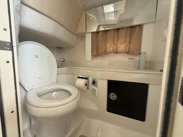  Yacht Photos Pics 2024 Formula 350 Crossover Bowrider bathroom with toilet, sink, and storage.